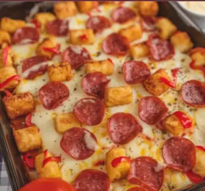 Pizza Tot Casserole 🍕🥔 a-photo-of-a-baking-dish-containing-a-delectable-d-82IZKy0RTMeRv1ekNJSvjA-ZjXul_TLQfejqA5V8kWkuQ